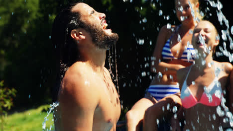 Man-flipping-his-hair-in-swimming-pool