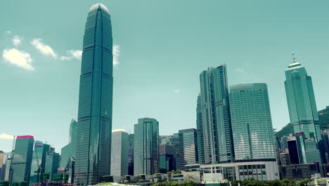 beautiful wide angle shot of central, hong kong cityscape from kowloon side, view from the water. sunny day