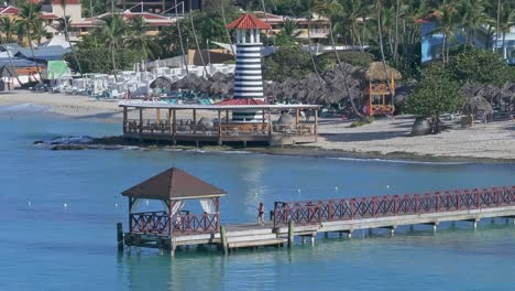 tropical beach resort with pier and lighthouse