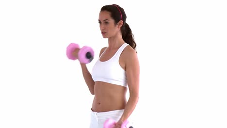 athletic hispanic woman working out with dumbbells