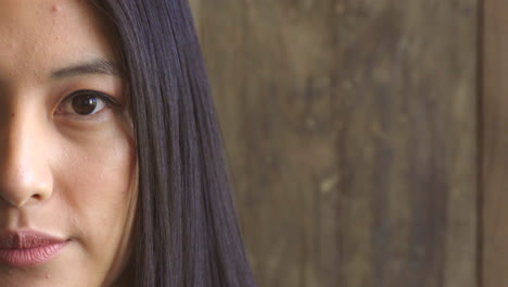 portrait of a woman with an intense stare blinking