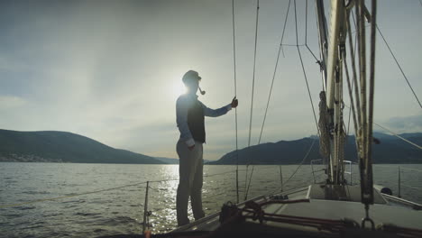 captain on a yacht at sunset