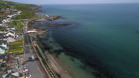 Aerial-shot-of-Whitehead,-a-seaside-village-in-Co