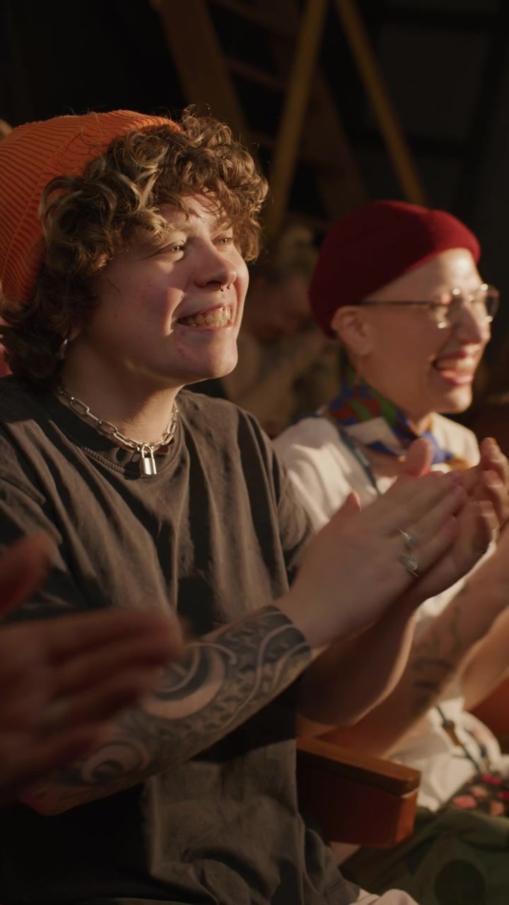 Young Woman Clapping and Laughing during Stand Up Performance
