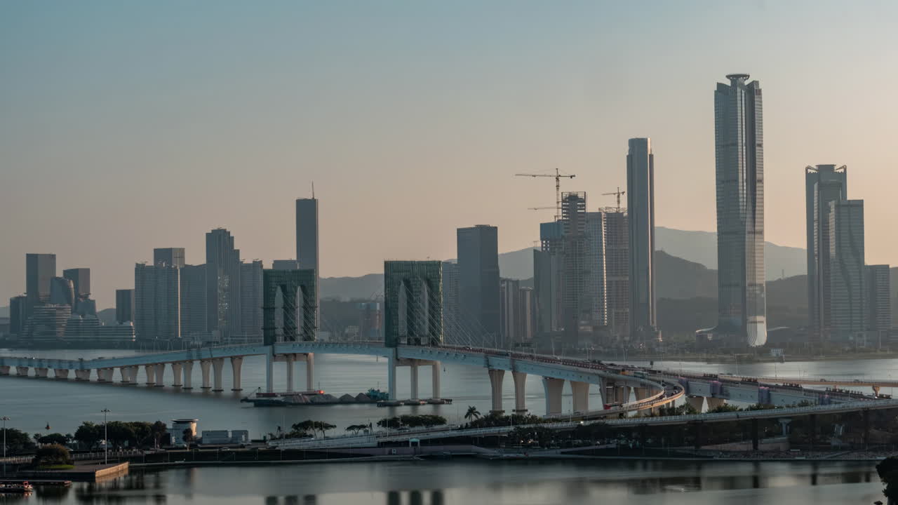 Modern Cityscape with Expansive Bridge and Skyscrapers