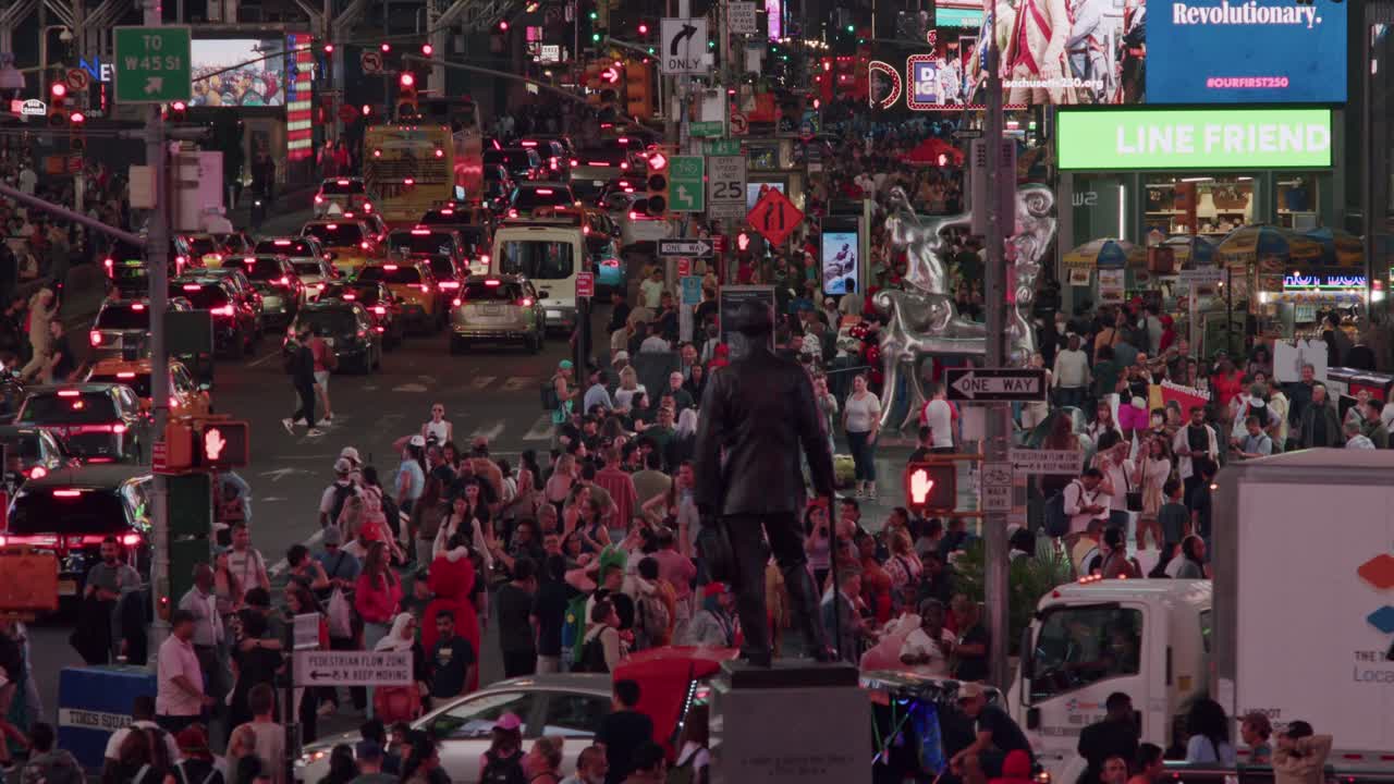 Bustling Times Square filled with people and traffic, surrounded by glowing billboards at dusk