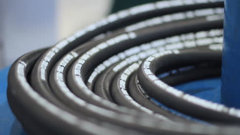 Industrial-hose-is-wound-in-hank-during-production-process.-Manufacture-of-hoses