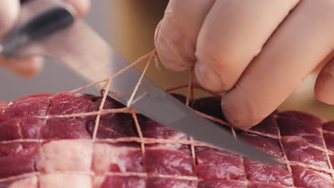 preparing a tied roast beef