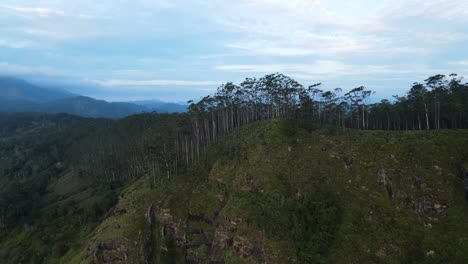 Aerial-drone-forward-moving-shot-over-Ella-Rock-with-famous-viewpoint-visa-in-Sri-Lanka-while-hiking-at-sunrise