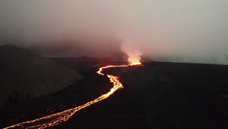 Drohnenaufnahme-Des-Vulkans-Litli-Hrutur-In-Island-Mit-Nebel-Und-Rauch-13