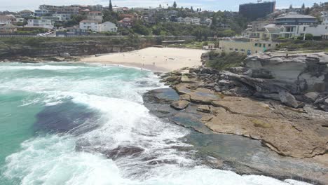 tamarama point headland with tamarama beach in eastern suburbs, new south wales, australia