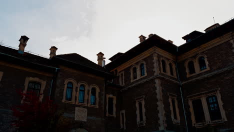 exterior of the beautiful old-fashioned mansion. beautiful cut bushes decorating the entrance to the building.