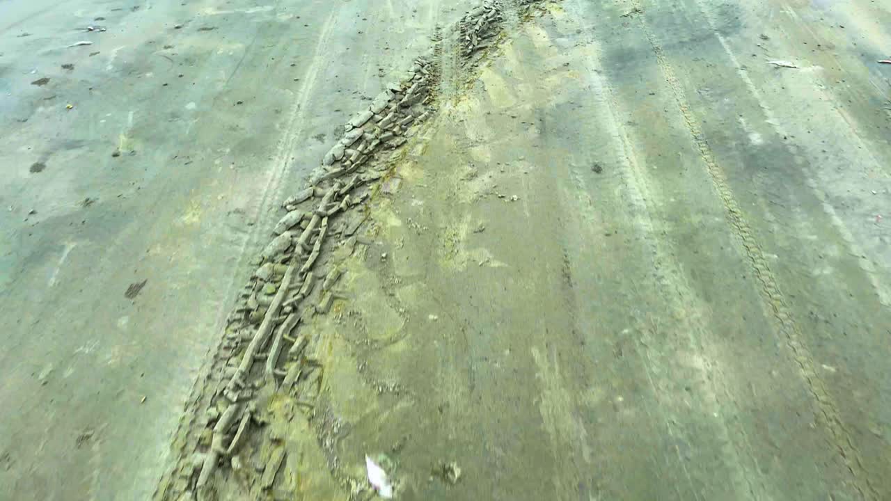 Traces On The Sandy Shoreline Of Tropical Beach. Pullback Shot