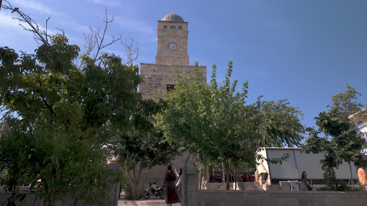 Stone Clock Tower in a Town Square