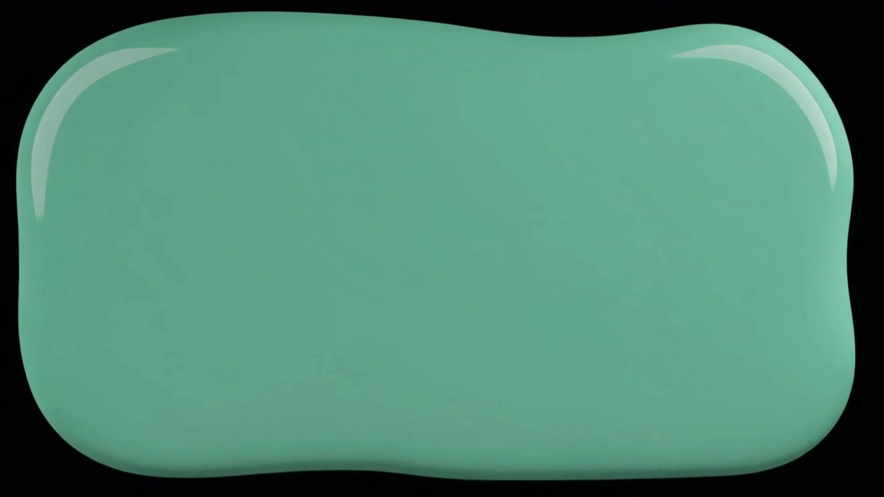 A Pool of Mint Green Paint Spreading on a Black Surface