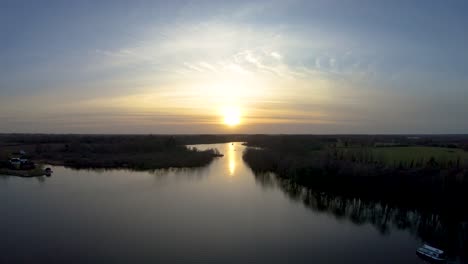 aerial drone footage on a sunset over a norfolk broad