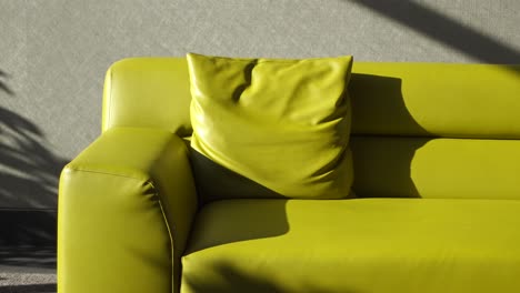 bright lime green sofa with pillow