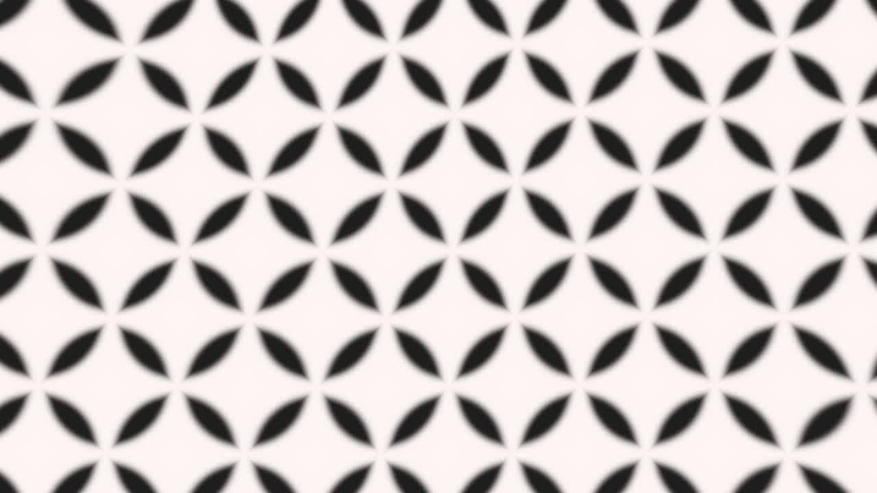 Geometric black and white grid pattern with sharp-edged squares and rectangles, repeated