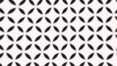 Geometric black and white grid pattern with sharp-edged squares and rectangles, repeated