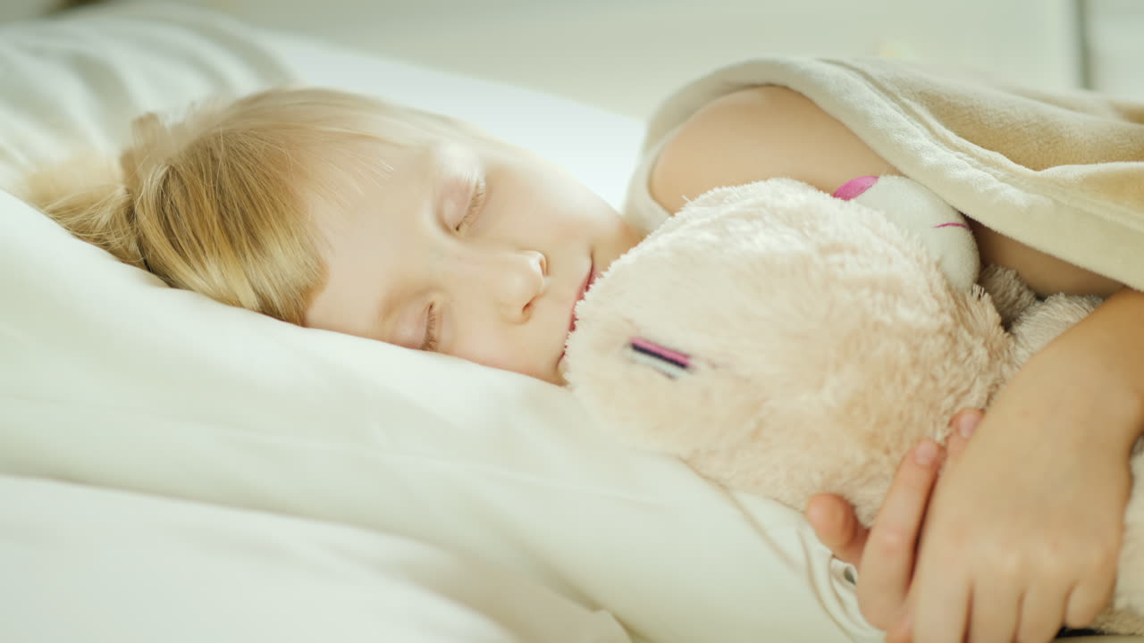 Little Girl Is Sleeping In Bed Top View 19