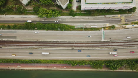 panning drone flying over busy highway roads