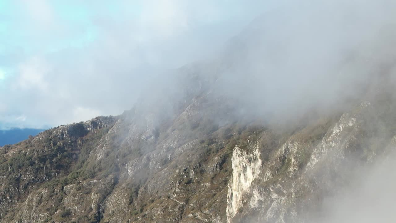 Stunning aerial view of Alps mountains in Italy with mist and clouds