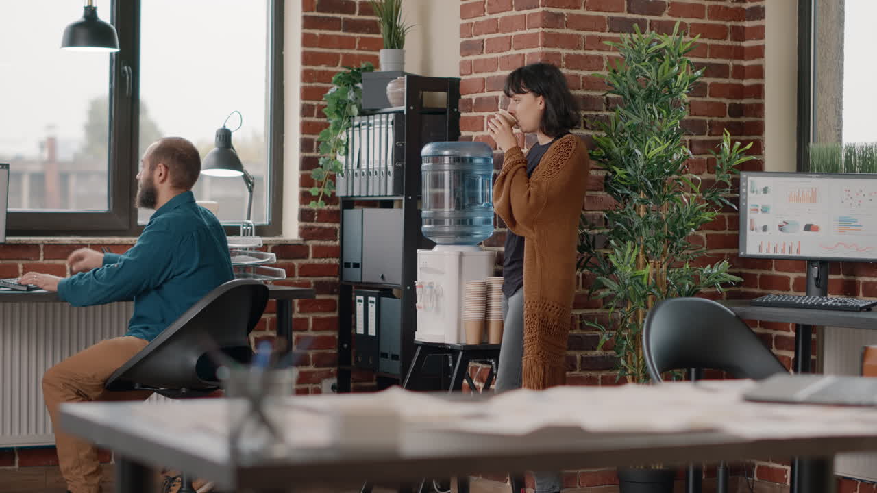 People in the office near a water cooler