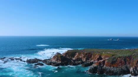 flyover cliffs and ocean waves along the pacific coast.