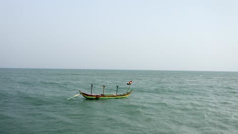 boat with flag on sea