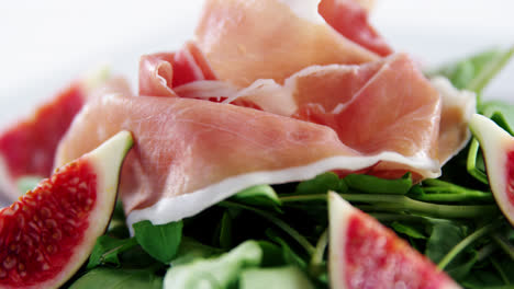 raw meat and vegetables on plate