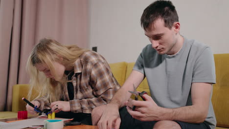 couple making paper crafts at home