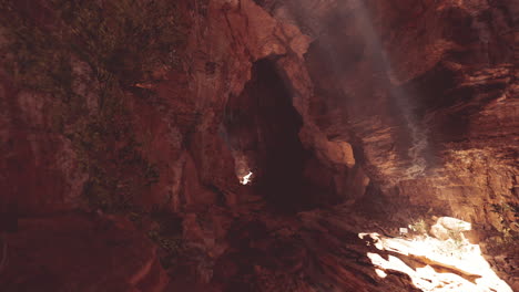 sunlight streaming through the entrance of a cave