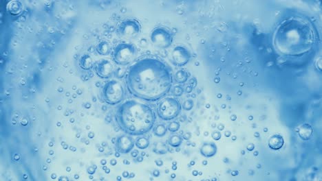 oxygen bubbles in water on a blue abstract background