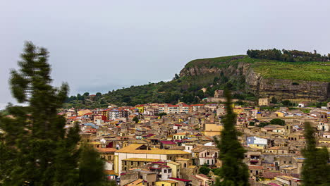 static view of the town of corleone, palermo province, sicily, italy at daytime with white cloud movment in timelapse