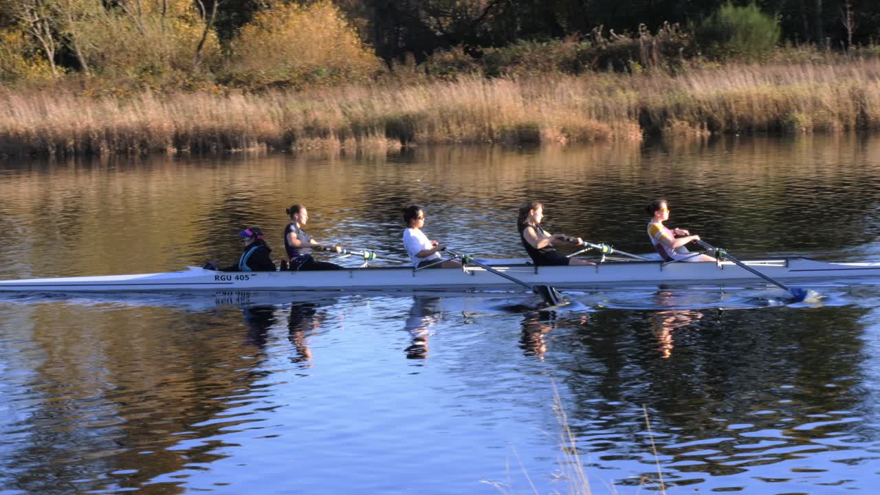 Women's Rowing Team on a River