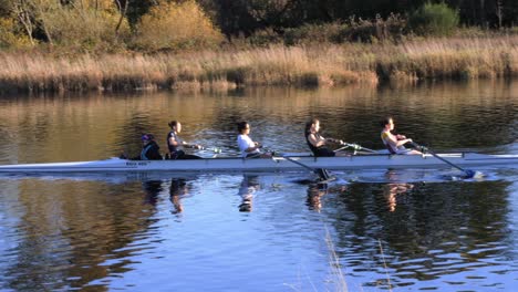 women's rowing team on a river