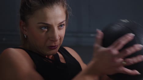 woman working out with medicine ball