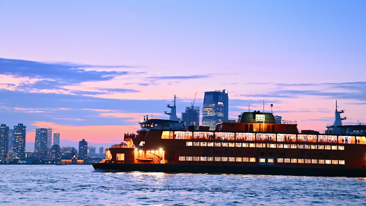 Long modern cruise boat with light on moving by the riverscape. River cruise by New York at dusk time