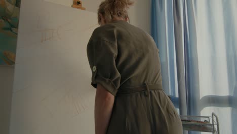 woman painting in her art studio