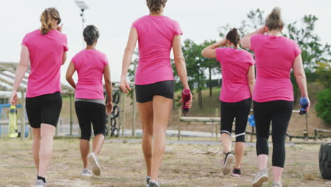 female friends enjoying exercising at boot camp together