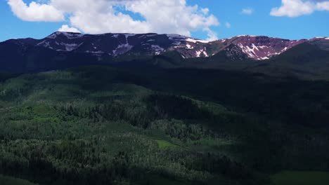 Old-mount-Snowmass-Resort-Colorado-aerial-drone-view-Aspen-Mt-Sopris-Wilderness-summer-June-July-Rocky-Mountains-peaks-farmland-landscape-sunny-bluesky-Capital-Peak-National-Forest-circle-right