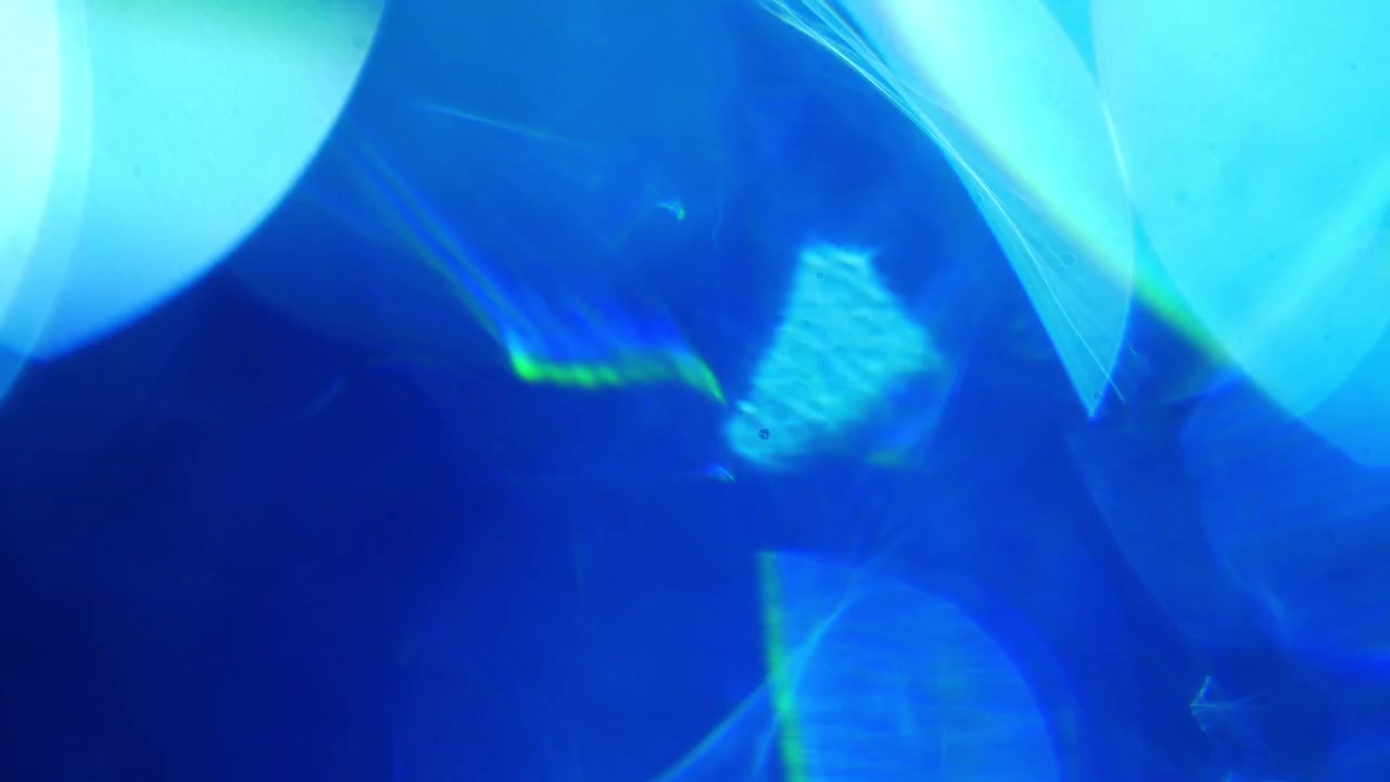 Fondo abstracto azul con fugas de luz y destellos de lente