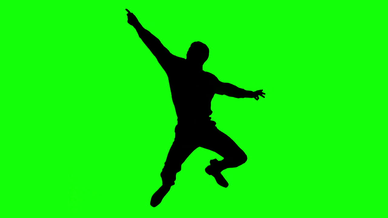 silueta de un hombre haciendo baile de discoteca en la pantalla verde