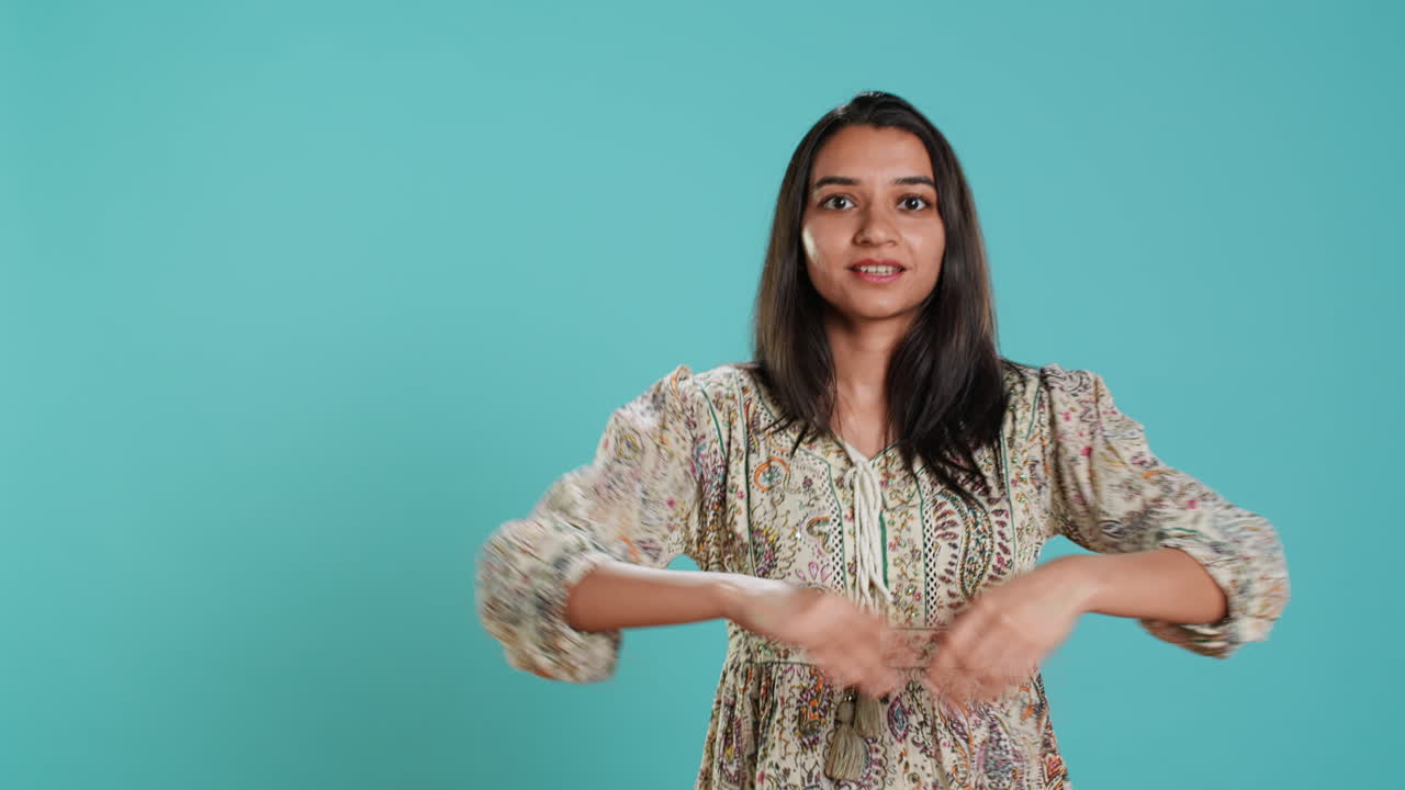 Cheerful woman entertaining herself by dancing