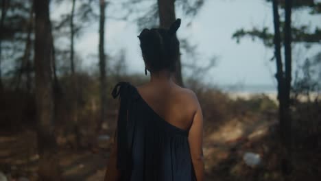 girl walks through natural forest