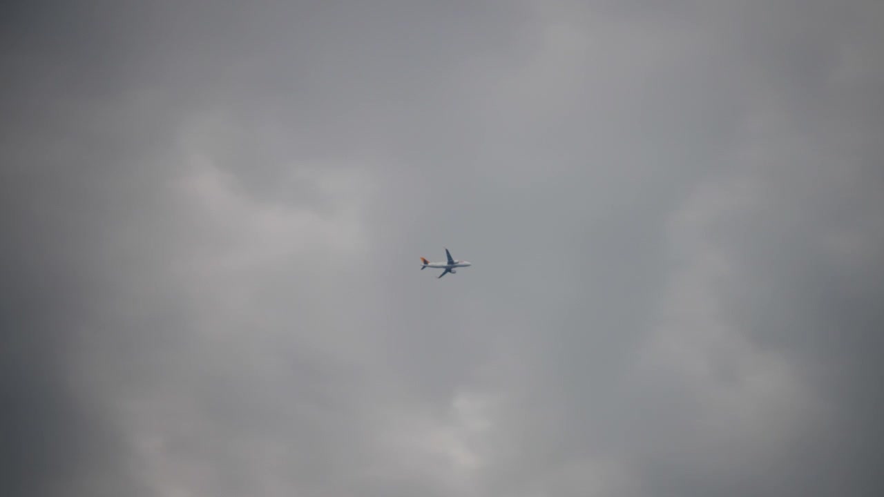 An airplane flying through stormy clouds