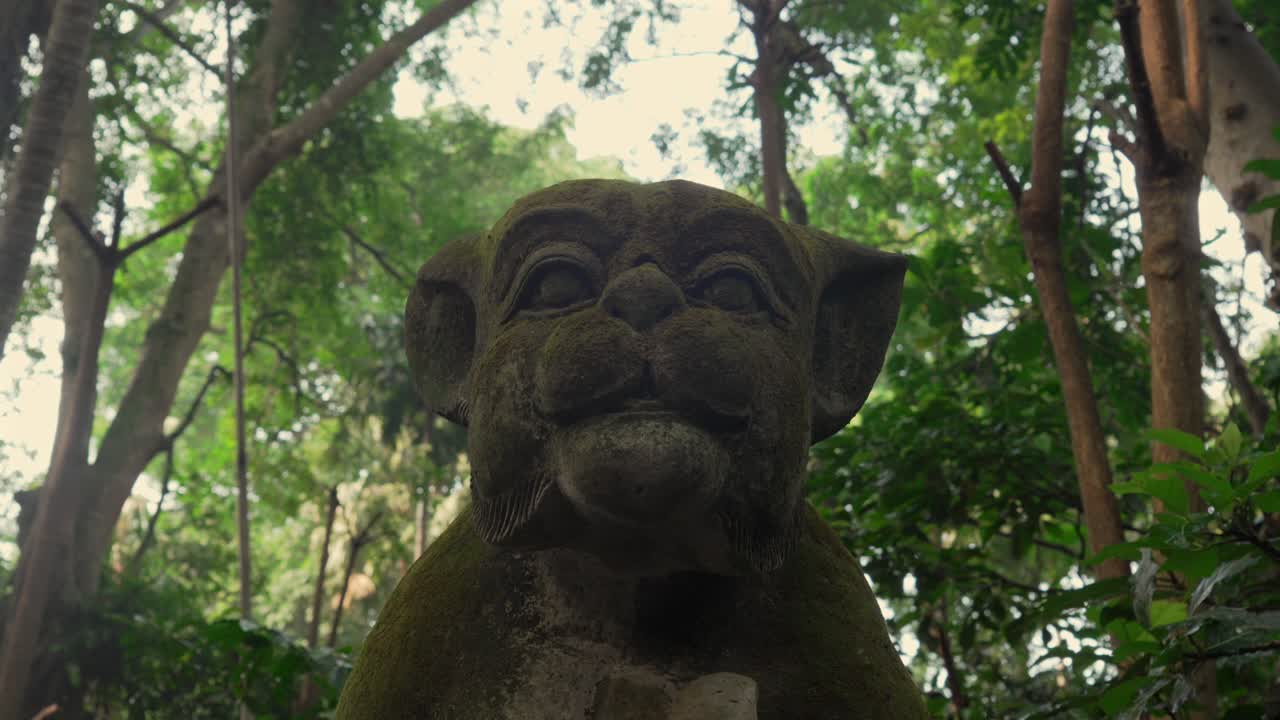 Puma leopard stone sculpture Ubud Monkey forest Bali Indonesia jungle up-close