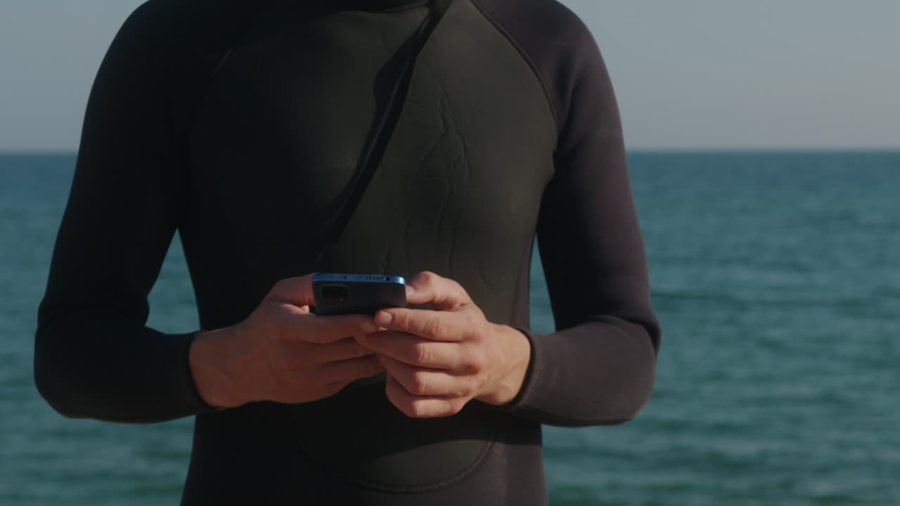 Surfer man walking to the beach at sunset preparing for surfing training and search for waves in Barcelona, spain, water, ocean exercise in sea with board, athletic male holiday or travel in vacation