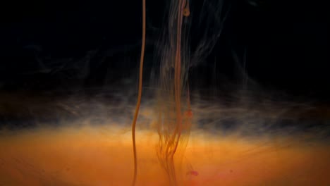 abstract red ink diffusion psychedelic movement flow. acrylic paint. fantastic hypnotic surface. abstract paint metamorphosis structured. ink swirling underwater. cloud of paint on black background.