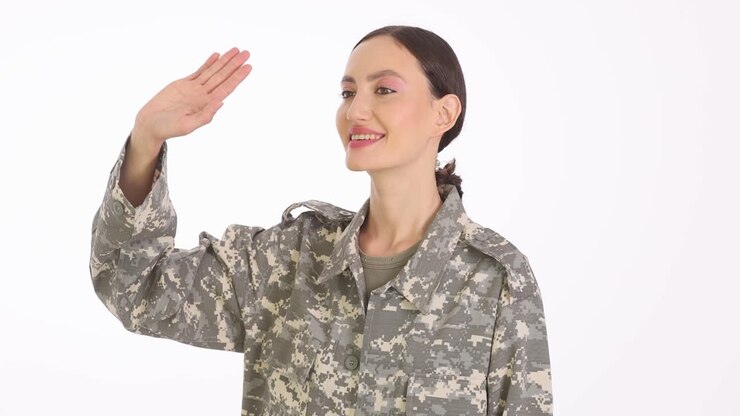 Woman in military uniform saluting or waving